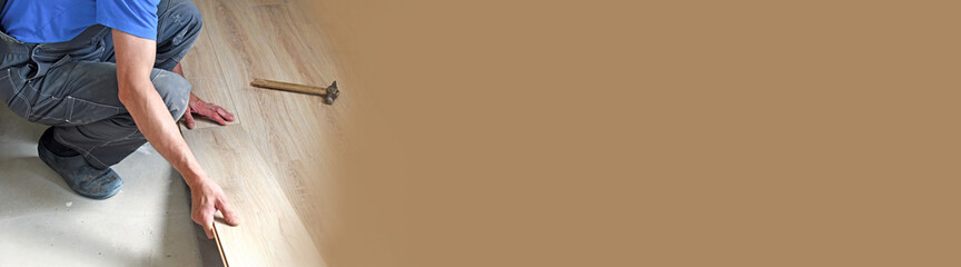 male carpenter puts the laminate