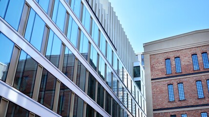 Revitalized red brick building and modern office building.