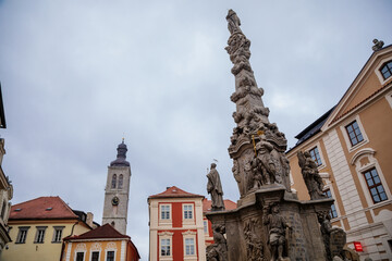 Fototapeta na wymiar The Plague Column of the Virgin Mary Immaculate, Narrow medieval picturesque street with baroque and renaissance historical buildings, Kutna Hora, Central Bohemia, Czech Republic