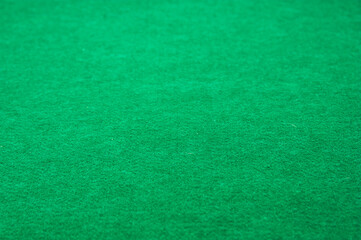 Closeup of a green synthetic fiber play mat with copy space