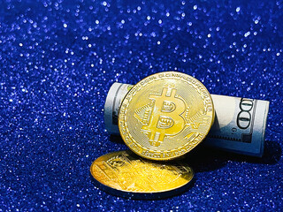 Golden bitcoin coins with glitter background, crypto currency concept.