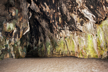 Inside a large cave in limestone crock on the beach. Grotto. Palinuro, Italy