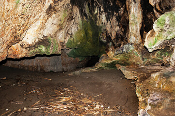 Inside a large cave in limestone crock on the beach. Grotto. Palinuro, Italy