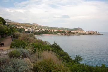 Fototapeta na wymiar Calanca bay with the path that runs along part of the coast. Marina di Camerota, Italy.
