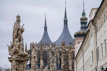 Fototapeta premium St. Barbara's Church, Unique gothic Cathedral and Former Jesuit College, gallery with baroque statues at Barborska street in winter, Kutna Hora, Central Bohemia, Czech Republic