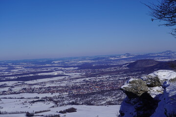 View from the top of Breitenstein on the Swabian Alb, with trees, far view, snow, wintertime, Ochsenwang near castle Teck, Bissingen unter Teck, Germany