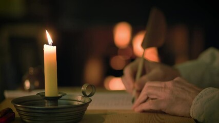 A cozy 1800s scene lit by the warm glow from a candle and fireplace of a man writing a letter using a quill pen.
