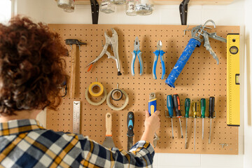 various diy tools hanging on the wall