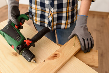 Close up of a drill on a workbench