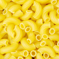 Italian pasta (Gomiti Rigati) on white background