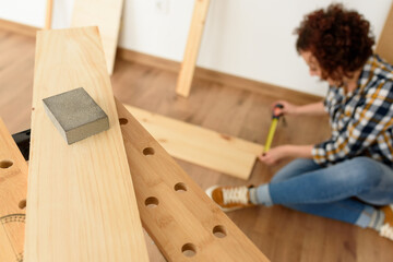 A woman worker in the carpenter workroom renovation