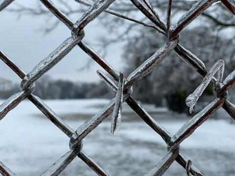 Icy chainlink fence close up