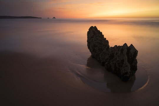 Liencres beach at sunset in a dreamy landscape in Cantabria, North of Spain.