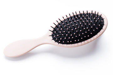hairbrush isolated on white background. pink hair brush cut out. design element. personal grooming accessory