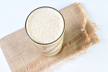 
Coffee and chocolate milkshakes, with chantilly cream on white wooden background