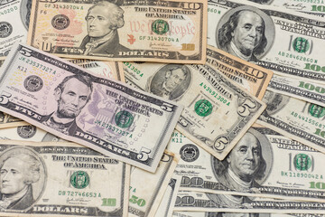 Lots of dollar bills on a table. Dollars on the table