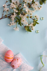 Easter card mockup made of Easter eggs, spring flowers and space for text 