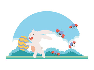 cute little bunny easter with egg painted and spring flowers in the garden