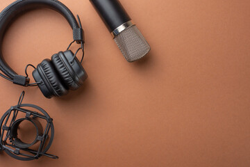 Studio microphone and headphones on the background, blogger, stream, radio and podcasts. top view,...