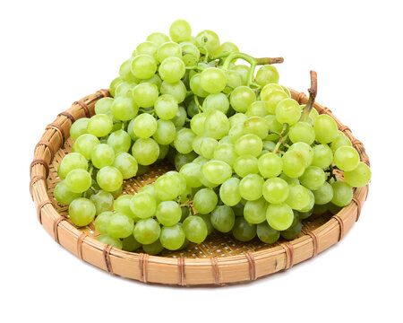 green grapes on white .