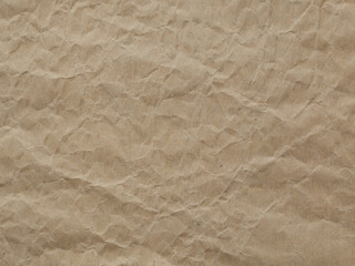 A sheet of wrinkled brown craft paper is shown in a closeup view.