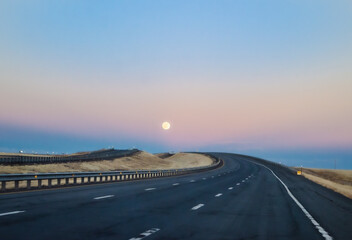 Moon rise driving on the highway