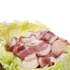 Raw pork belly pieces on a white background