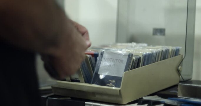 User browsing vintage computer floppy disks