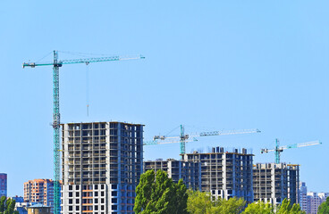 Crane and highrise construction site