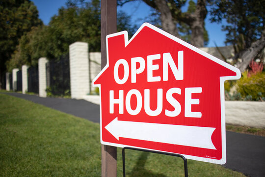 open house sign on the street