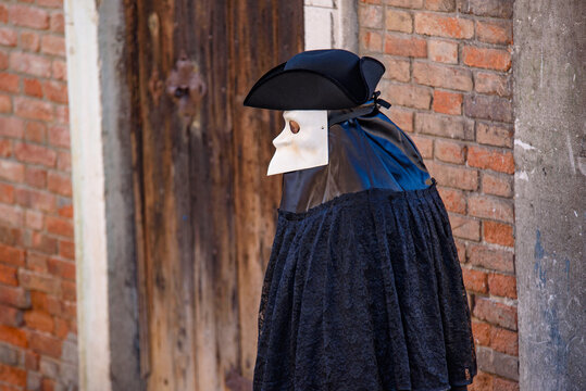 A street performer with Bauta mask in Venice, Italy