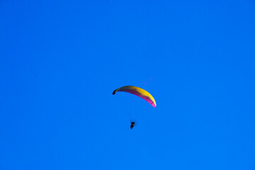 paragliding in the blue sky