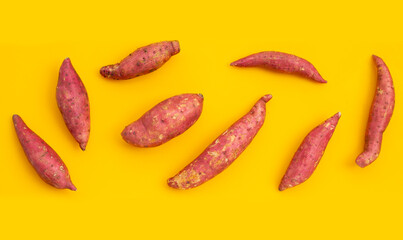 Sweet potato on yellow background.