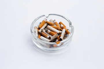 Smoked cigarettes on white background.
