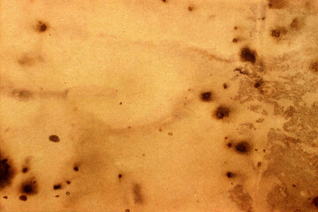 Old brown paper grunge background. Abstract liquid coffee color texture.