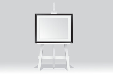 Wooden easel stand with picture frame on white background
