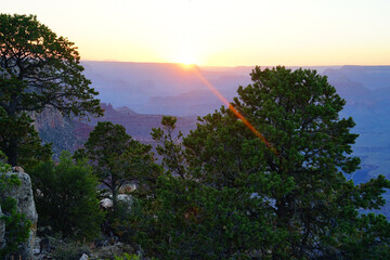 Golden Sunset at Grand Canyon Arizona. Blue smoky haze accentuates the canyon