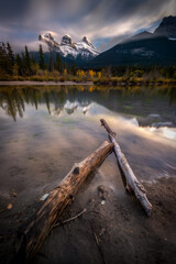 The iconic Three Sisters in Canmore, Alberta, Canada from Policemen Creek just before sunset in late September.