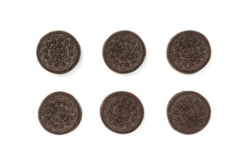 Biscuits chocolate  with crumbs on white background. It is a chocolate cookies with a sweet cream.