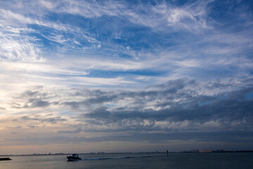 Boat in the ocean on the summer day blue skies