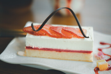 Piece of cheesecake with fresh strawberries
