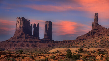 Rock formations at monument valley under evening sky