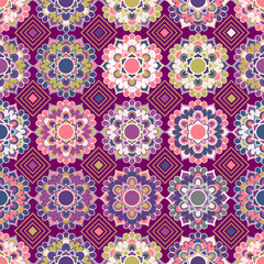 Geometric colorful floral ornament mandala flowers seamless vector pattern design on a purple background. Traditional style. Print fabric. Card