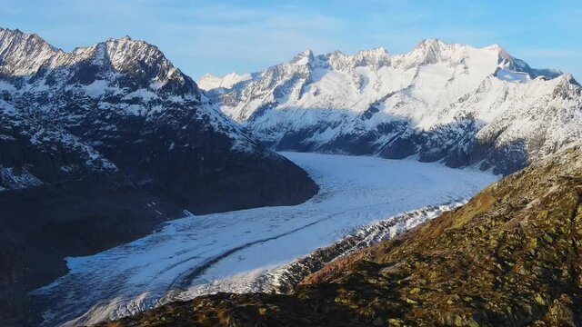 Aerial view over the largest glacier in Europe - the Aletschgletscher in the Swiss Alps - drone footage