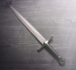 Renaissance Style Sword on a Wooden Background