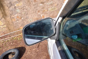 side mirror of a white car background