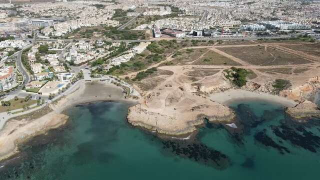 Beach Cala La Mosca in Orihuela Costa Alicante, southeast of spain. Drone footage in 4K and 60 fps for slow motion.
