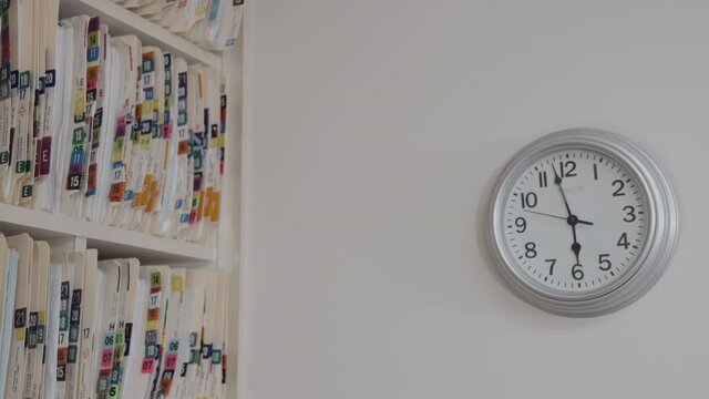 Medical cards on shelves in hospital. Health insurance folders in archive files. Records and catalogs in medicine clinic. Patient healthcare information