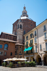 Fototapeta na wymiar Italy, Lombardy, Pavia. Cathedral and outdoor cafe