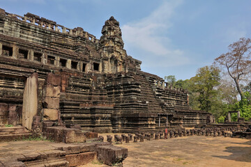 Ancient stone temple of Baphuon in Angkor. A dilapidated building in the shape of a stepped...